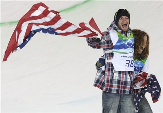 Olympic bronze winner Scott Lago, left, celebrates with gold medalist Shaun White after the men's snowboard halfpipe final on Wednesday. Lago said he worked with a sports psychologist in an attempt to stop choking in big events.